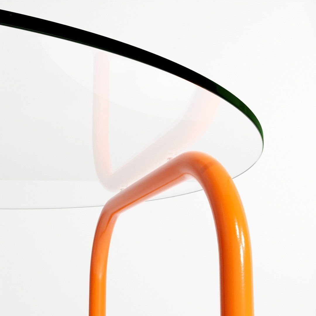 a close up of a glass table with an orange frame