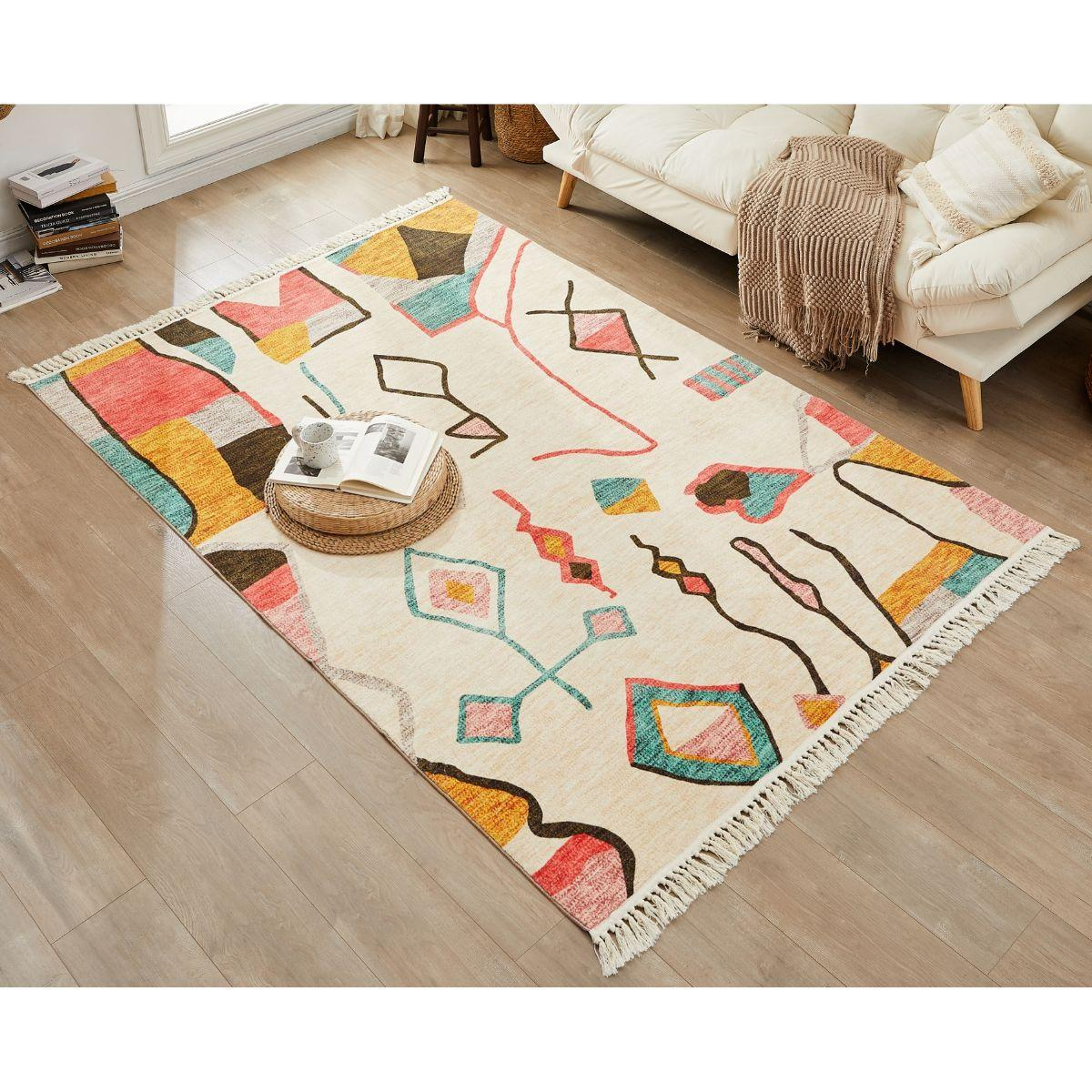 a white rug with a colorful design on it