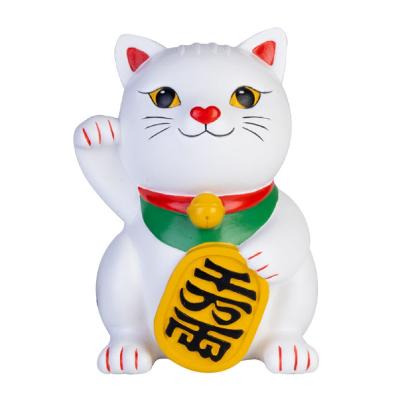 a white cat figurine with a yellow tag