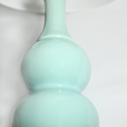 Pattery Barn Green Ceramic Table Lamp with Chic White Shade and Unique Pottery-Inspired Design