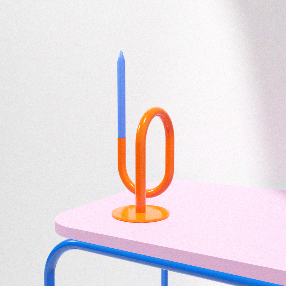 a pink table with a blue and orange object on top of it